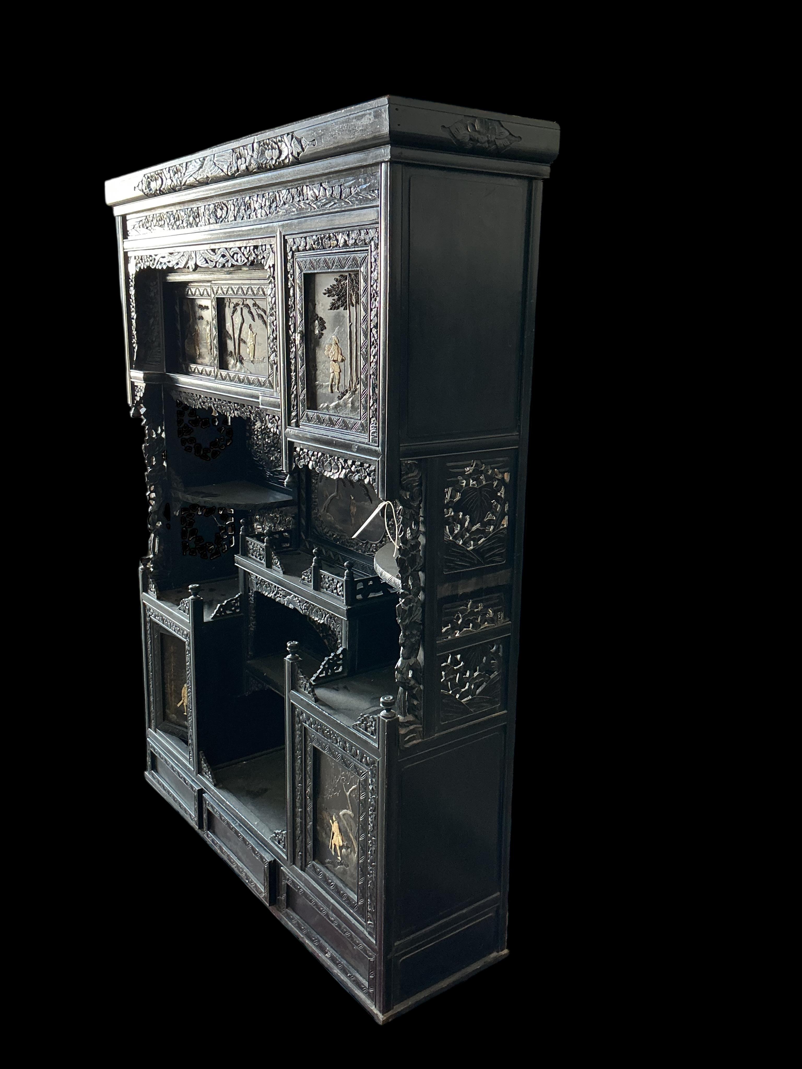 A Japanese Meiji period ebonised cabinet, width 110cm, depth 32cm, height 150cm CITES Submission reference Q4A31H9Q